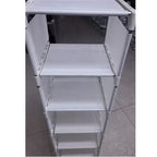 Close-up of the fabric shelves and metal frame of the shoe rack