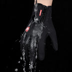 Black winter glove with water poured over it to demonstrate water resistance