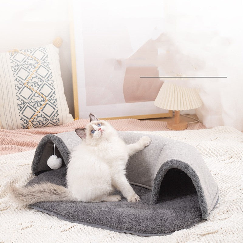 Oval cat tunnel bed with soft plush mat and hanging ball
