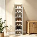 White 8 tier metal shoe rack filled with shoes in an entryway